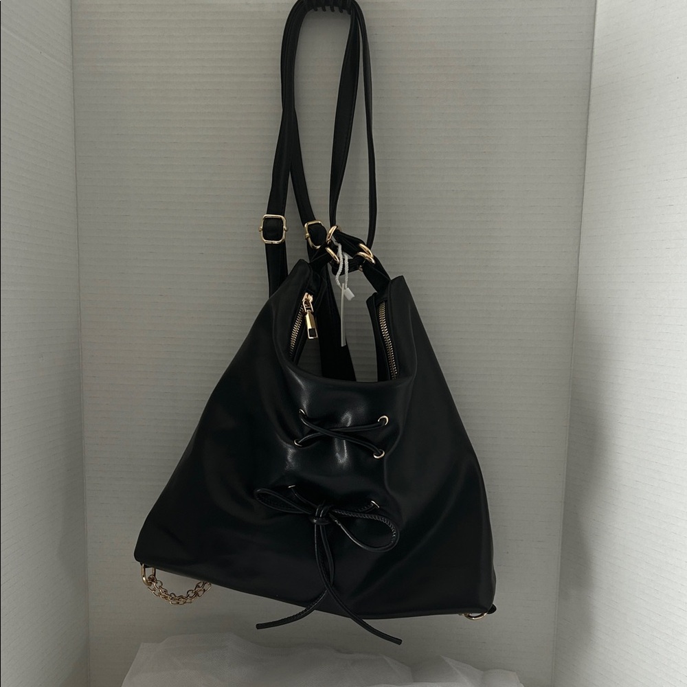 Black Faux Leather convertible drawstring backpack and crossbody shoulder bag.